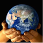 A person holding a globe in their hands.