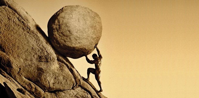 Man pushing large boulder uphill.