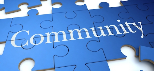 Blue puzzle pieces spelling "Community.