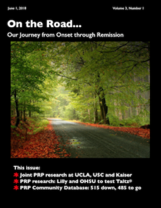 Magazine cover with a forest road.