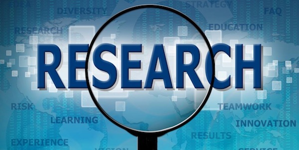 Magnifying glass over the word "Research".