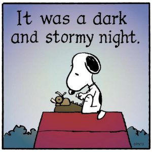 Dog typing on a red doghouse roof.