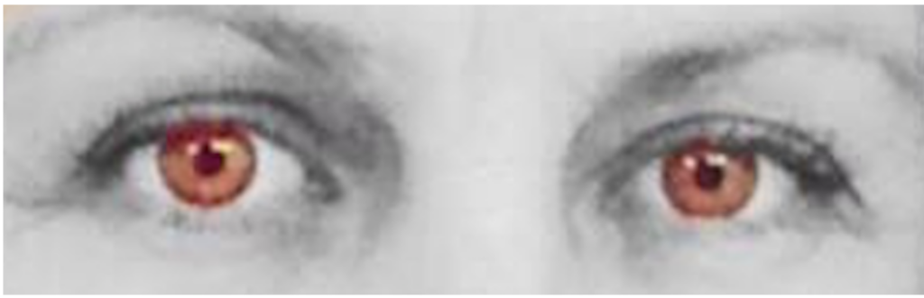 Eyes with red irises and grayscale surroundings.