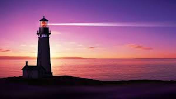 Lighthouse silhouette against a vibrant sunset.