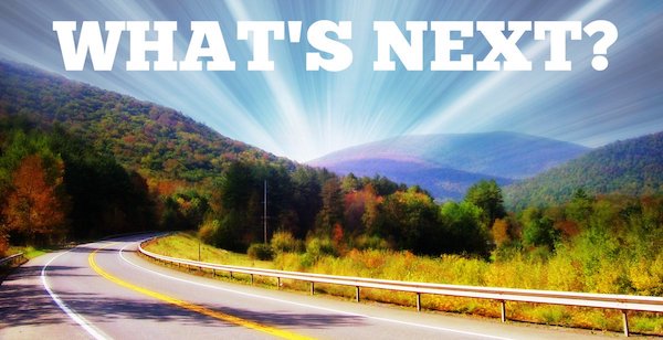 Scenic road with "What's Next?" text.