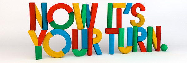 Colorful letters spelling "Now It's Your Turn.