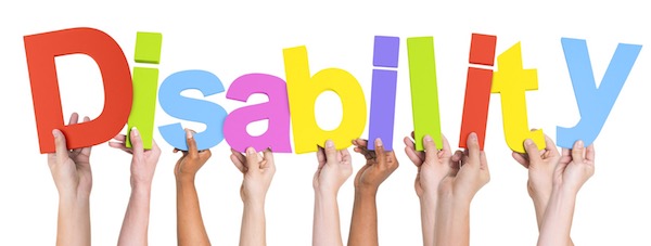 Hands holding colorful "Disability" letters.