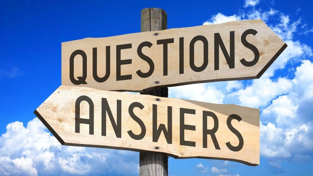 Questions and answers signpost against sky.