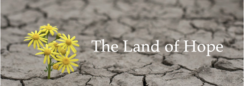 A close up of the words " the land of hope ".