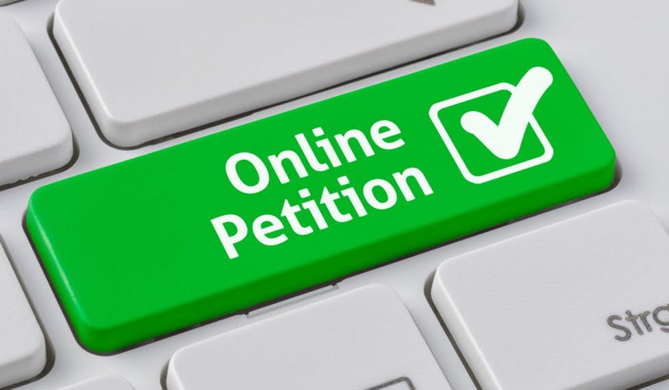 Green "Online Petition" button on keyboard.