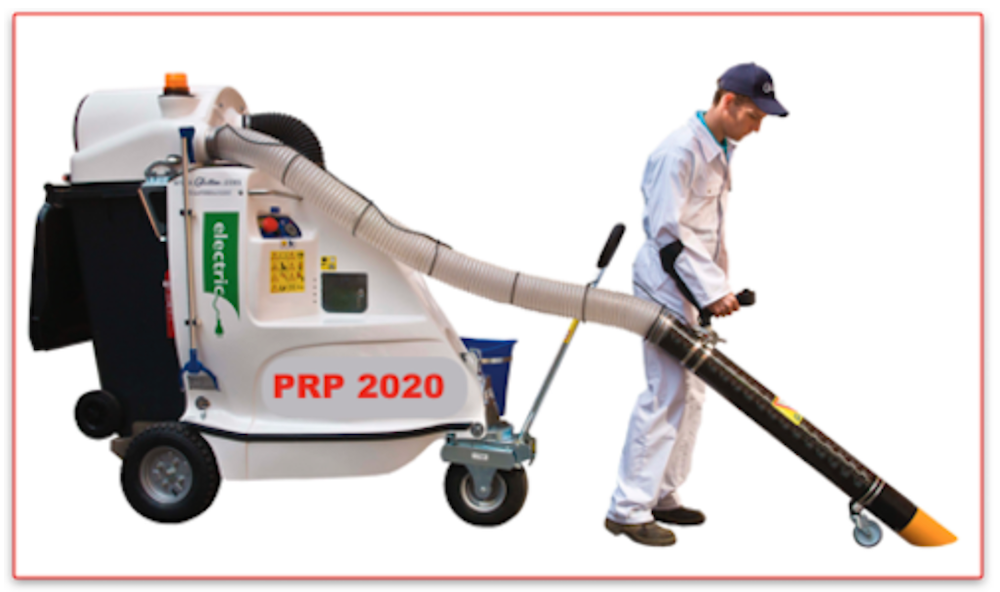 Worker operating large outdoor vacuum machine.