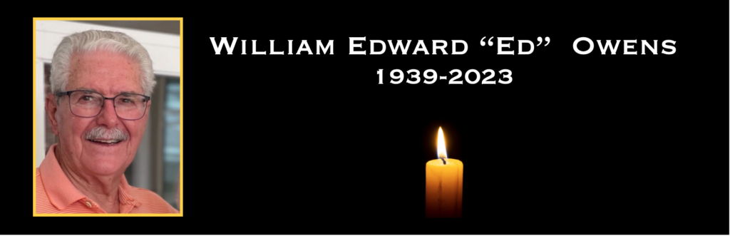 Memorial tribute with candle and portrait.