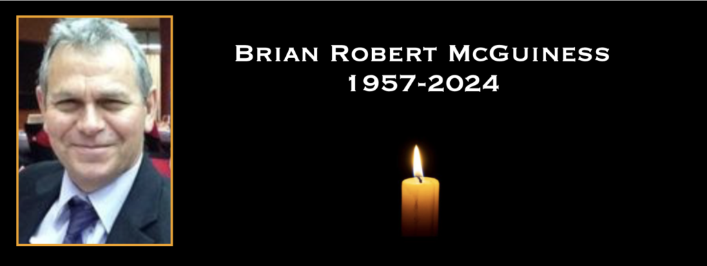 Memorial image with candle and portrait.