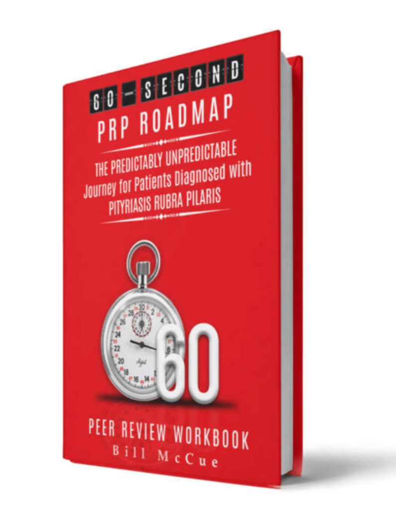 A red book with the cover of a peer review workbook.