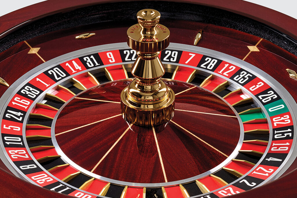 Roulette wheel with numbers and gold center.